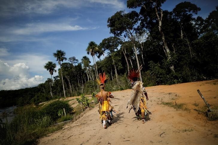 Indigenous people of the Pareci community walk in the village of Wazare near the town of Campo Novo do Parecis, Brazil, April 26, 2018. REUTERS/Ueslei Marcelino SEARCH "INDIGENOUS SOY" FOR THIS STORY. SEARCH "WIDER IMAGE" FOR ALL STORIES.