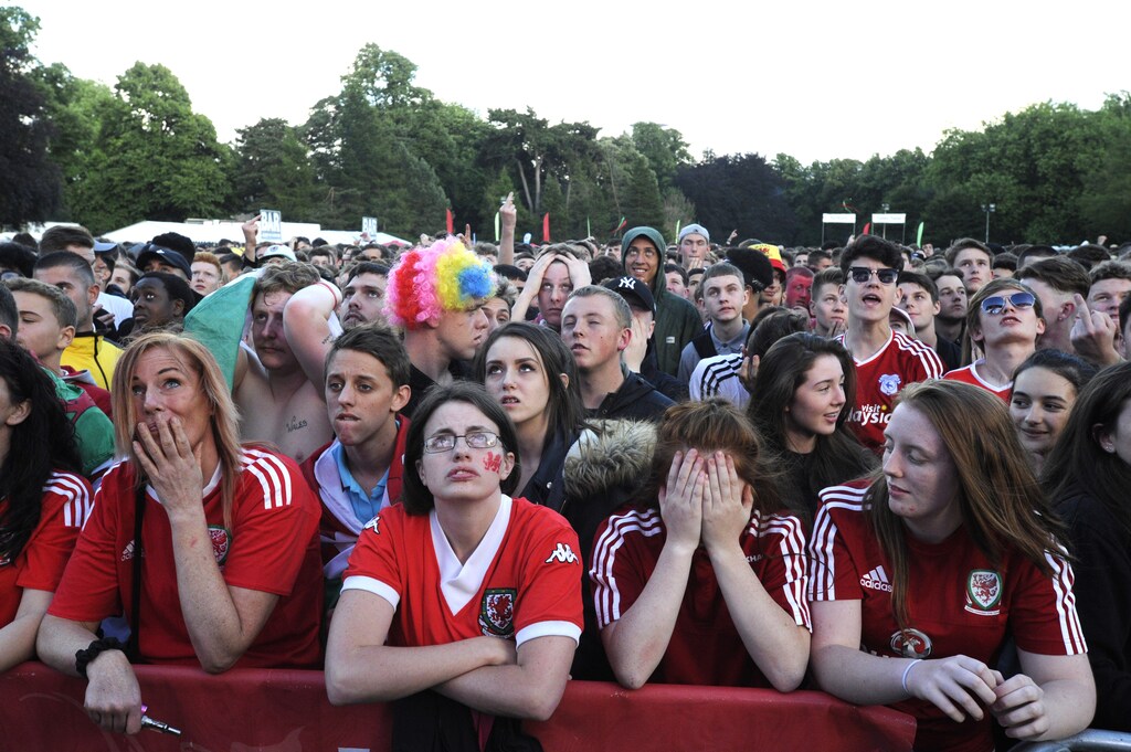 Welsh fans show their disappointment after Belgium scored their first goal, to be shown on a giant screen in the Fanzone, Coopers Field, Cardiff, Wales, July 1, 2016. REUTERS/Rebecca Naden