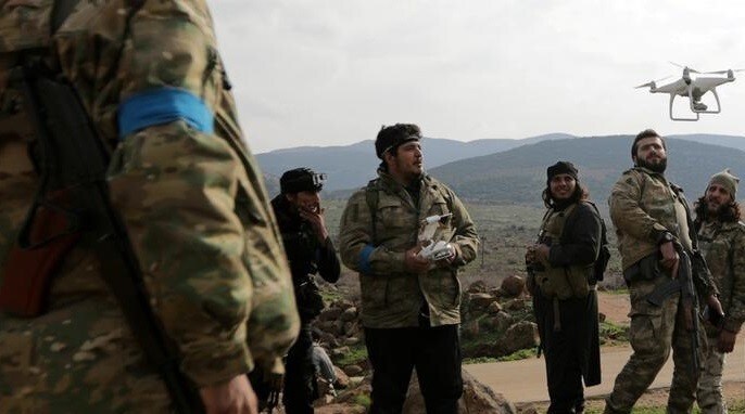 Turkish-backed Free Syrian Army fighters fly a drone in Northern Afrin countryside, Syria, February 15, 2018. REUTERS/Khalil Ashawi TPX IMAGES OF THE DAY