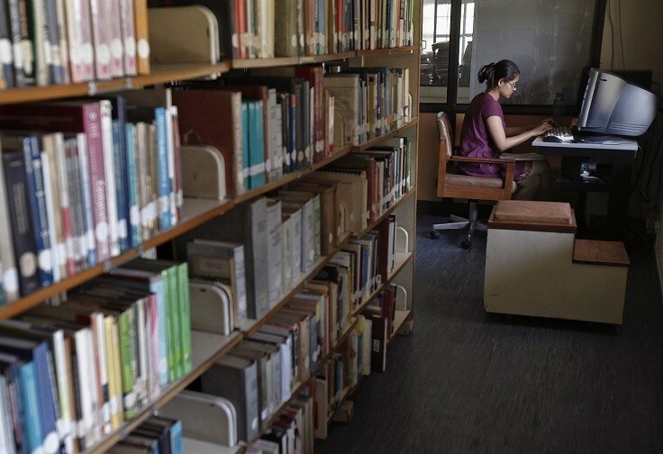 A Master of Business Administration (MBA) student works on a computer in a library at Management Development Institute (MDI) in Gurgaon, on the outskirts of New Delhi May 2, 2012. Fiscal constraints have increased the Indian government's reliance on private education institutes leading to a proliferation of private colleges like MDI. The number of management institutes has more than trebled to around 4000 in the last five years, of which at least two-thirds are estimated to be private colleges. Picture taken May 2, 2012.
