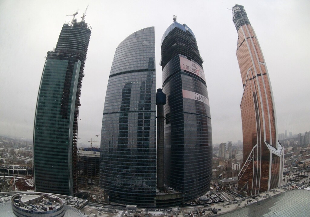 A general view shows the Moscow International Business Center and the Mercury City Tower (R) after a ceremony to present it as Europe's tallest skyscraper in Moscow, November 1, 2012. The 339 meters (1,112 feet) tall Mercury City Tower, primarily owned by billionaire Igor Kesaev, is one of the buildings forming the Moscow International Business Center also known as "Moskva-City". The tower, which is still under going construction, reached its full height making it at present, the tallest skyscraper in Europe, according to organizers of the ceremony and local media. REUTERS/Sergei Karpukhin (RUSSIA - Tags: BUSINESS CONSTRUCTION CITYSPACE REAL ESTATE) - RTR39V0S
