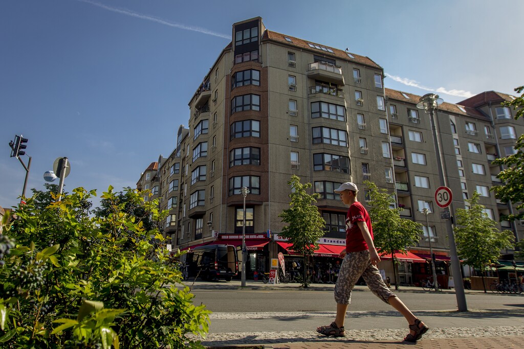 A boy walks past former East German apartment blocks at Berlin's Wilhemstrasse, July 25, 2012. Plans to demolish former East German apartment blocks in a prime central Berlin location have stoked fears about the loss of the city's socialist heritage and its seemingly relentless gentrification. Picture taken June 25, 2012. REUTERS/Thomas Peter (GERMANY - Tags: REAL ESTATE BUSINESS SOCIETY) - GM1E881009G01