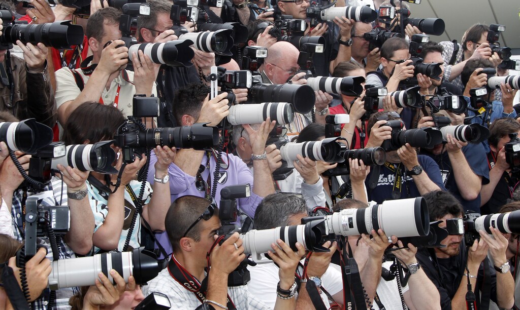 Photographers shoot with their cameras during a photocall at the 63rd Cannes Film Festival May 12, 2010. Nineteen films compete for the prestigious Palme d'Or which will be awarded on May 23. REUTERS/Eric Gaillard (FRANCE - Tags: ENTERTAINMENT MEDIA) - GM1E65C1N6Z01