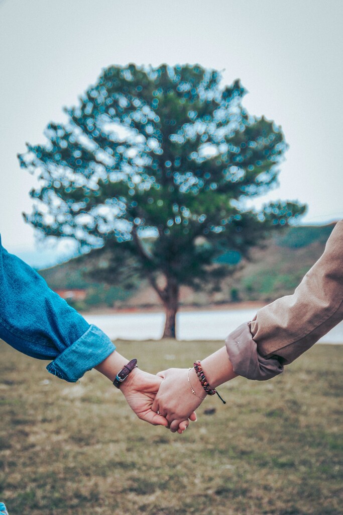 Two people holding hands.