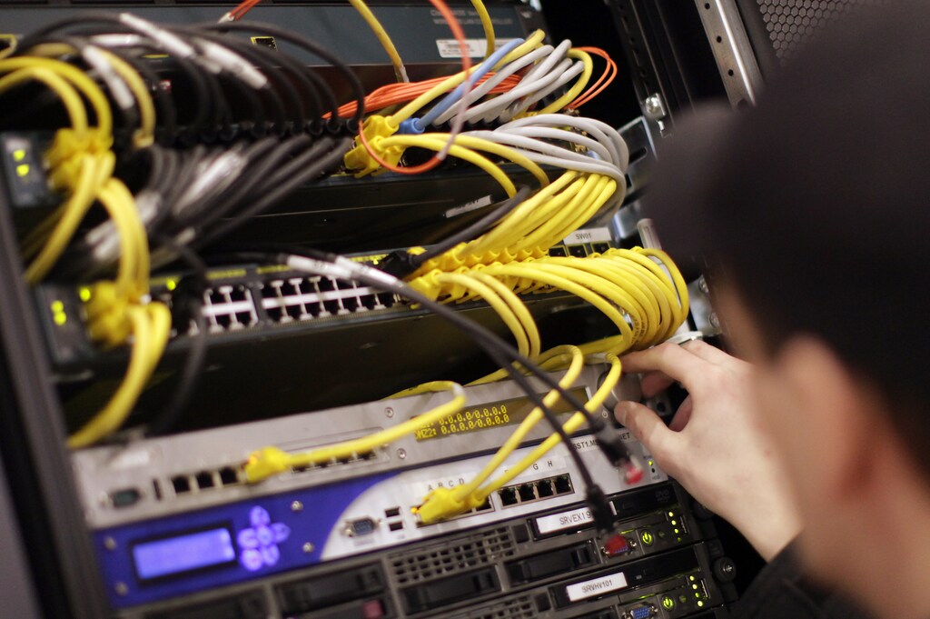 A worker prepares prepares a network server of a stand for the upcoming CeBIT fair inside a hall in Hanover February 27, 2009. The world's biggest IT fair CeBIT with 4300 exhibitors from 69 countries opens its doors to the public on March 3, and runs through March 8, 2009. REUTERS/Hannibal Hanschke (GERMANY) - BM2E52R14YB01