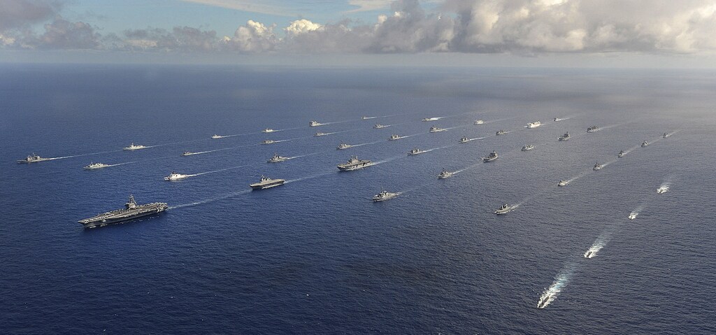 More than 40 ships and submarines representing 15 international partner nations travel in formation in the Pacific Ocean during the Rim of the Pacific (RIMPAC) 2014 exercise in this U.S. Navy photo taken July 25, 2014, and released July 31, 2014. RIMPAC is a U.S. Pacific Fleet-hosted biennial multinational maritime exercise. REUTERS/U.S. Navy/Mass Communication Specialist 1st Class Shannon E. Renfroe/Handout (UNITED STATES - Tags: MILITARY POLITICS) THIS IMAGE HAS BEEN SUPPLIED BY A THIRD PARTY. IT IS DISTRIBUTED, EXACTLY AS RECEIVED BY REUTERS, AS A SERVICE TO CLIENTS. FOR EDITORIAL USE ONLY. NOT FOR SALE FOR MARKETING OR ADVERTISING CAMPAIGNS - TM3EA7V187V01