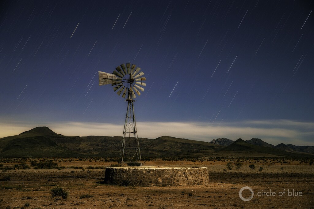 A windmill on the land of Bodie Means, 68, near Valentine, Texas. The Davis Mountain Range is in the background.