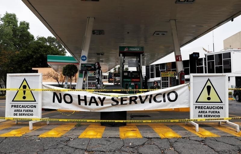 A general view shows a closed gas station, in Mexico City, Mexico January 14, 2019. The banner reads; "There's no service". REUTERS/Henry Romero - RC16DA70AD00