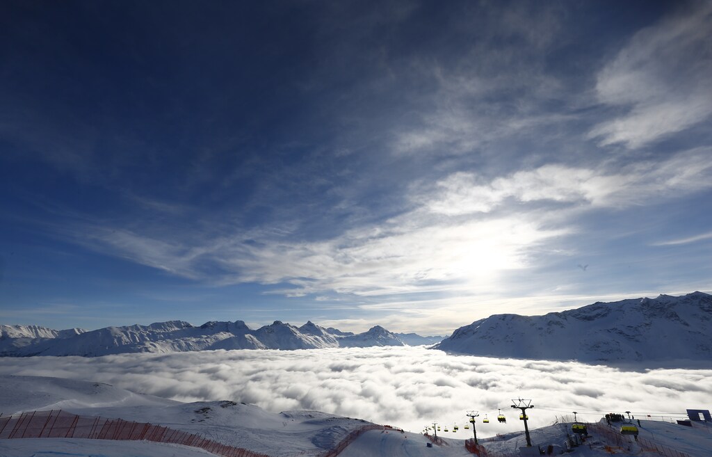 Alpine Skiing - FIS Alpine Skiing World Championships - Women's Super G - St. Moritz, Switzerland - 9/2/17 - Fog lies in the valley of St. Moritz as the sun shines over the Engadine mountains. REUTERS/Dominic Ebenbichler - LR1ED290OVTCW