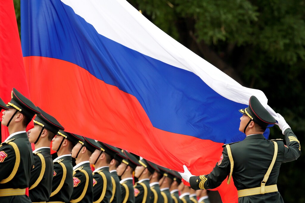 An honour guard holds a Russia flag during preparations for a welcome ceremony for Russian President Vladimir Putin outside the Great Hall of the People in Beijing, China June 8, 2018. REUTERS/Jason Lee TPX IMAGES OF THE DAY - RC1543AE9580