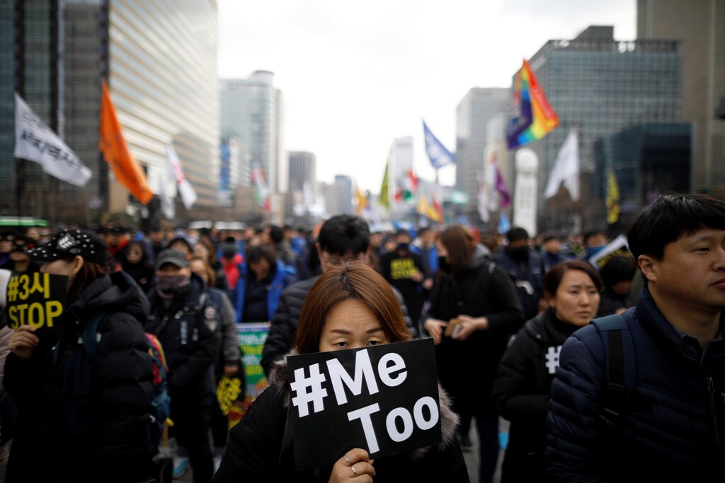 People attend a protest on International Women's Day in Seoul, South Korea.