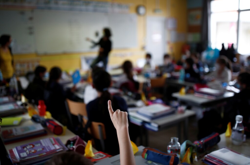Schoolchildren attend a lesson in their classroom at a private school in Saint-Sebastien-sur-Loire, as France will start its third national lockdown and shools will close for three weeks to push back a third wave of the coronavirus disease (COVID-19) infections, France, April 2, 2021.
