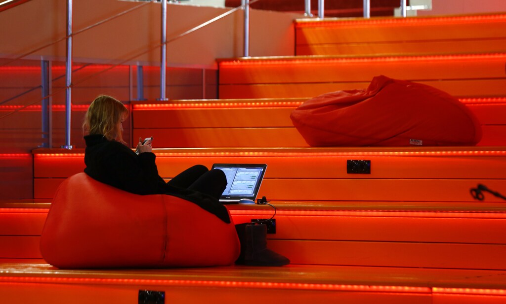 A woman with a laptop is seen in Hi-Tech Park Belarus building in Minsk, Belarus March 17, 2016. To match Insight BELARUS-TECH/ REUTERS/Vasily Fedosenko - D1AESVPXVQAB