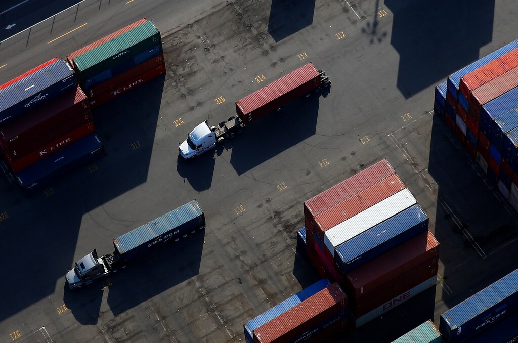 An aerial photo shows shipping containers loaded onto trucks at Harbor Island at the Port of Seattle in Seattle, Washington, U.S. March 21, 2019. Picture taken March 21, 2019. REUTERS/Lindsey Wasson - RC18C2BA6FF0