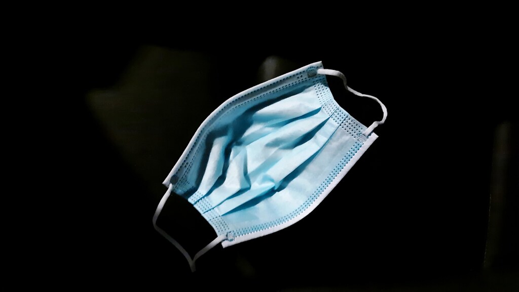 A blue disposable face mask.