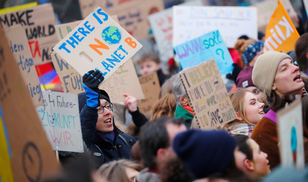 Pupils carry a banner reading "There's no planet B" during the "Fridays for Future" protest against coal and for climate protection in Berlin, Germany, February 1, 2019.