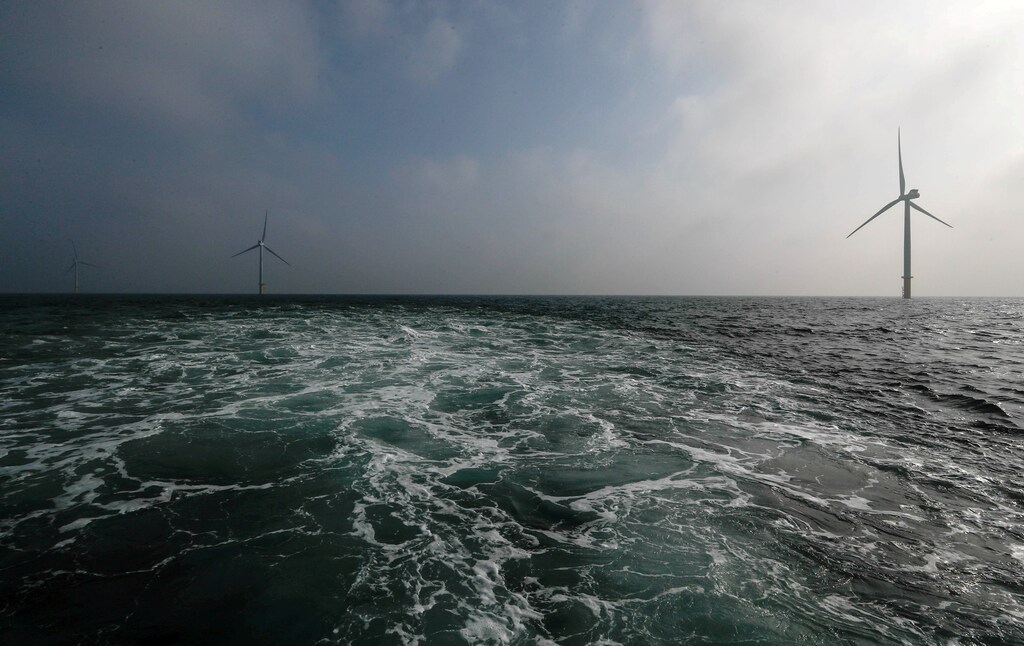 FILE PHOTO: Power-generating windmill turbines are seen at the Eneco Luchterduinen offshore wind farm near Amsterdam, Netherlands September 26, 2017. REUTERS/Yves Herman/File Photo