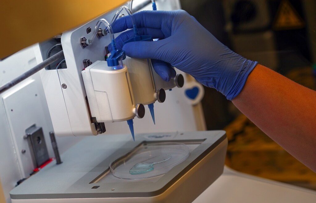 An employee checks the 3D printing of a scaffold for a kidney at Dr. Ali Ertuerk's laboratory in Munich, Germany April 23, 2019. Mr. Ertuerk and his team developed DISCO transparency technology which is used by scientists from diverse biomedical research fields to generate high resolution views of intact rodent organs and bodies, a milestone on the way to generate 3D-bioprinted human organs. Picture taken April 23, 2019. REUTERS/Michael Dalder - RC1EFF557D70