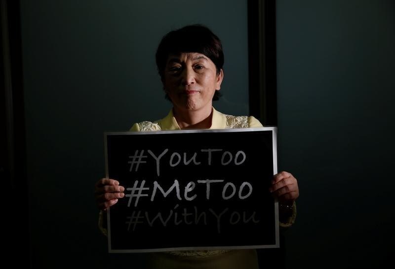 Social Democratic Party's lawmaker Mizuho Fukushima poses with the #MeToo banner during an interview with Reuters in Tokyo, Japan, April 24, 2018. Picture taken on April 24, 2018. REUTERS/Toru Hanai - RC11CE0921D0