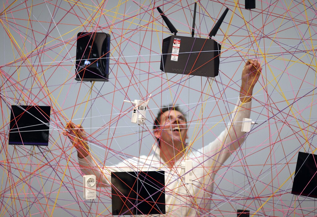 Devices produced by U.S. manufacturer of computer networking equipment Netgear are displayed on a web during the IFA Electronics show in Berlin September 4, 2014. REUTERS/Hannibal Hanschke (GERMANY - Tags: BUSINESS SCIENCE TECHNOLOGY) - RTR44XJF