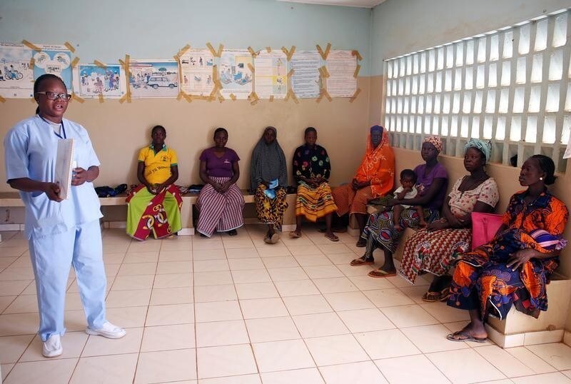A nurse from Marie Stopes NGO talks to women during a family planning course at a dispensary in the village of Nedgo, near Ouagadougou, Burkina Faso February 16, 2018. Picture taken February 16, 2018.