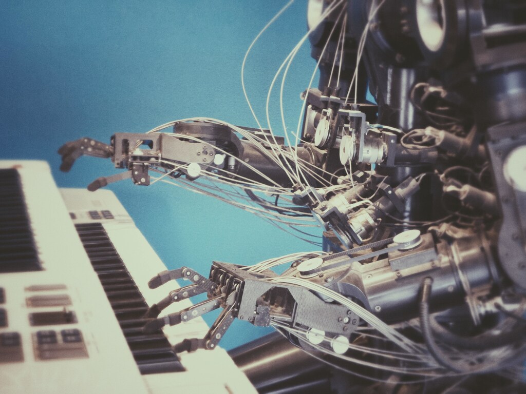 Davos 2023: This image shows a robot playing a piano, illustrating the importance of creating trustworthy AI