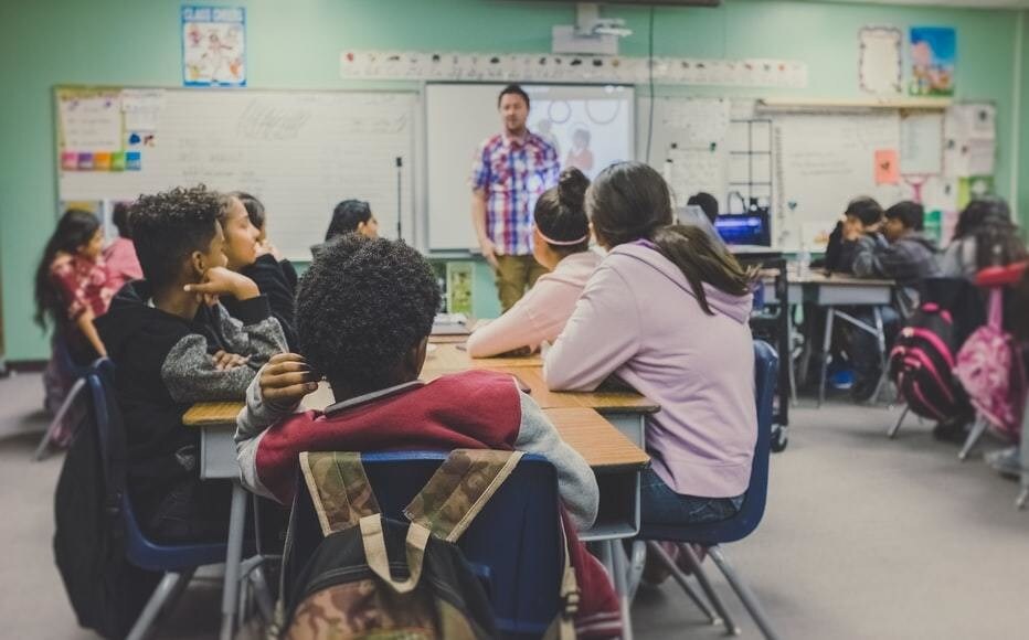 A teacher carries out a lesson in a school.