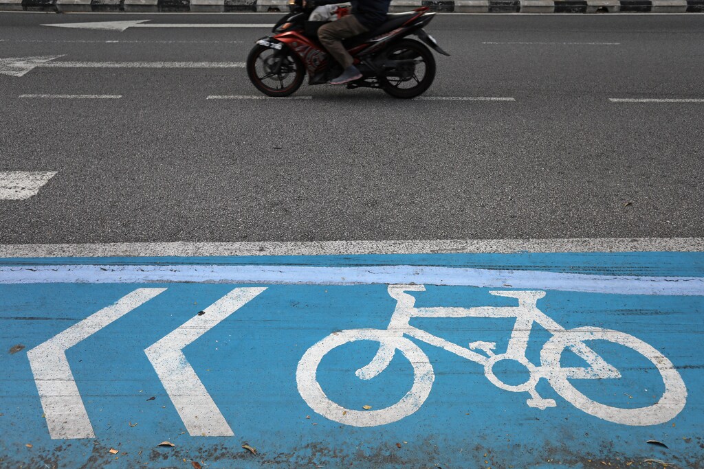 A bicycle lane is seen on a road