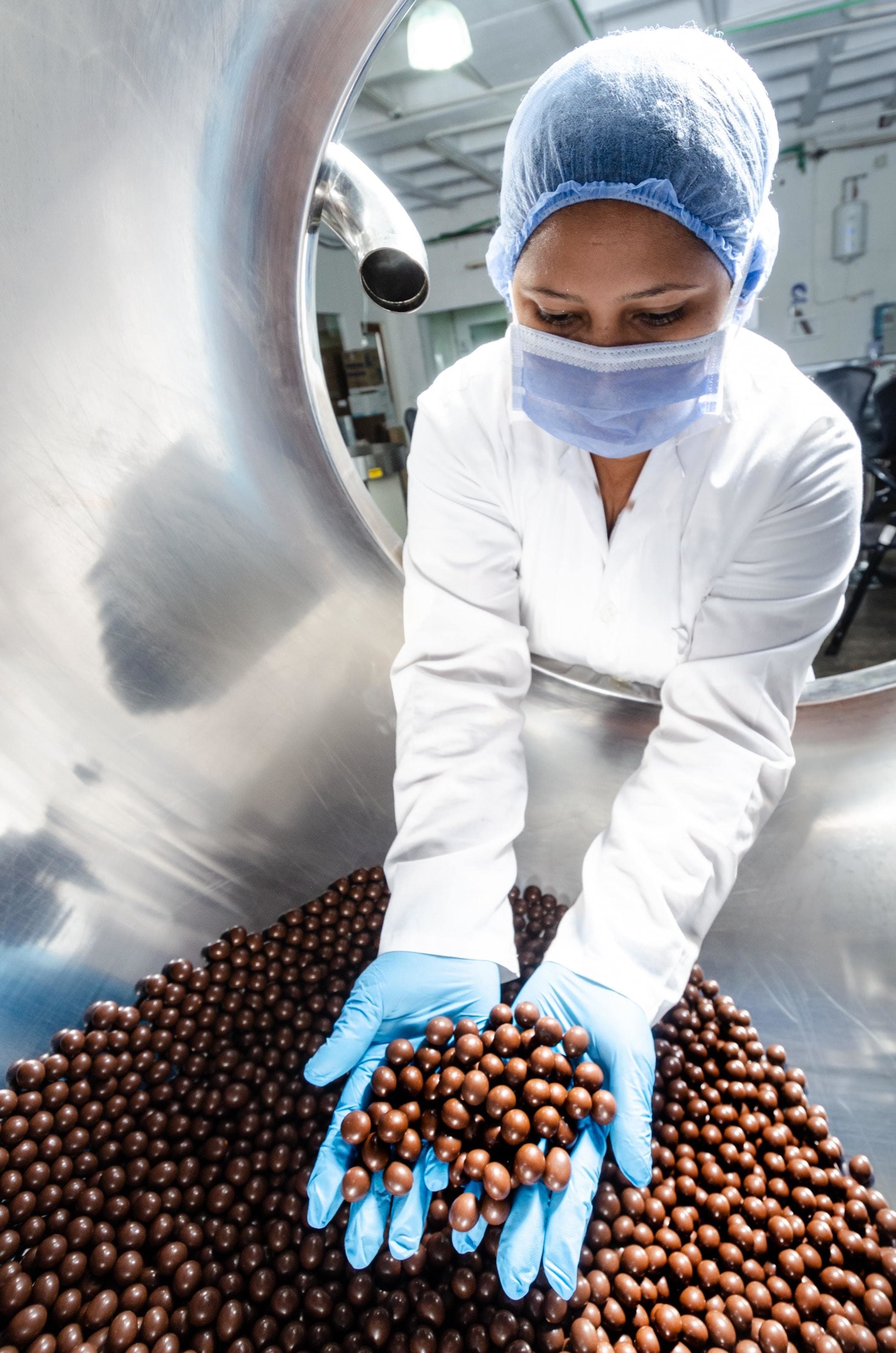 view of sustainable chocolate being prepared in a chocolate factory showing responsible practices.