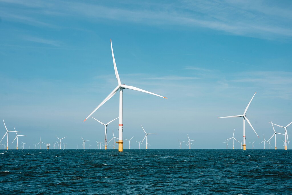 side view of offshore wind turbines in a story about clean energy and regulatory change