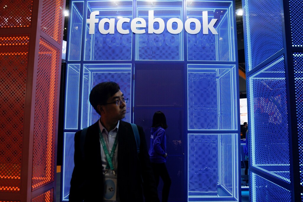 A Facebook sign is seen during the China International Import Expo (CIIE), at the National Exhibition and Convention Center in Shanghai, China November 5, 2018. REUTERS/Aly Song - RC19D269DBA0