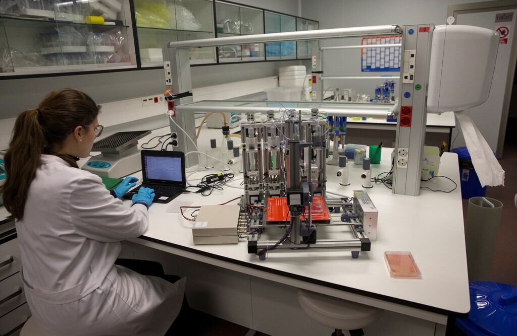 A scientist manages a 3D bioprinter prototype which for the first time is able to replicate human skin that can be used for transplants and testing in the cosmetic, chemical and pharmaceutical industries, at Carlos III University in Getafe, Spain, February 2, 2017. Picture taken February 2, 2017. REUTERS/Sergio Perez - RC15F8C78E60