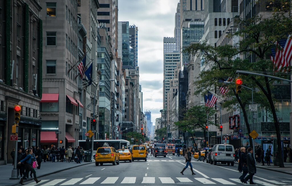 A view between the buildings of a busy New York City street