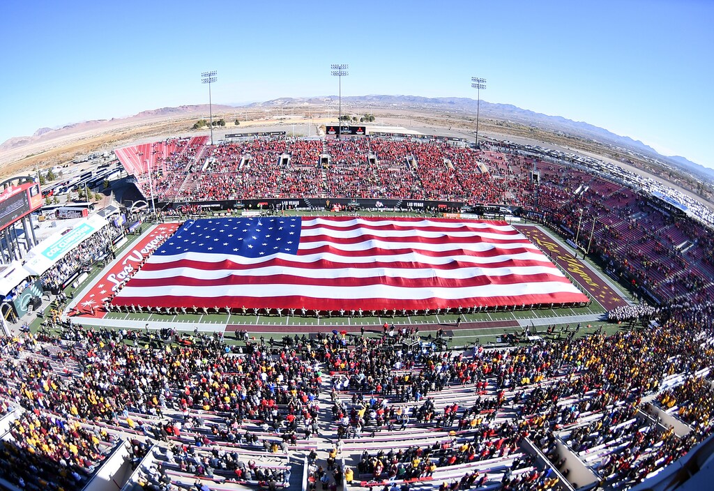 Dec 15, 2018; Las Vegas, NV, United States; The flag is presented during the performance of the National Anthem before the start of the Las Vegas Bowl at Sam Boyd Stadium. Mandatory Credit: Stephen R. Sylvanie-USA TODAY Sports - 11851246