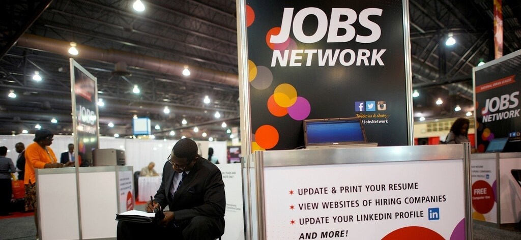 A job-seeker completes an application at a career job fair in Philadelphia, Pennsylvania, U.S. July 25, 2013