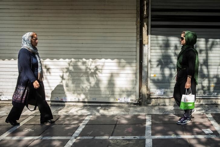 Iranian women walk on the sidewalk at Valiasr square in the center of Tehran, Iran, August 2, 2017. Nazanin Tabatabaee Yazdi/TIMA via REUTERS ATTENTION EDITORS - THIS IMAGE WAS PROVIDED BY A THIRD PARTY.