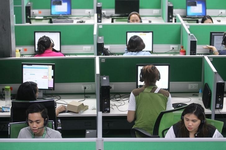 Employees work at a call center in Davao city in southern Philippines December 13, 2016. Picture taken December 13, 2016. To match Special Report PHILIPPINES-DAVAO/MODEL REUTERS/Lean Daval Jr