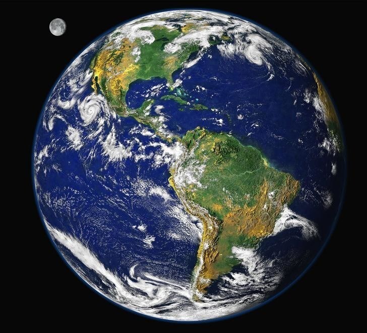 To mark Earth Day on April 22, 2000, NASA scientists released this new image of the Earth, updating the famous "Blue Marble" photograph taken by Apollo astronauts. The digital image uses data collected in 1997 from several satellites to approximate what a human could see from orbit, with the added artistic license of having the Moon in the background. The prominent storm raging off the west coast of North America is Hurricane Linda. The image of the Moon has been magnified to about twice its relative size.RC/PB