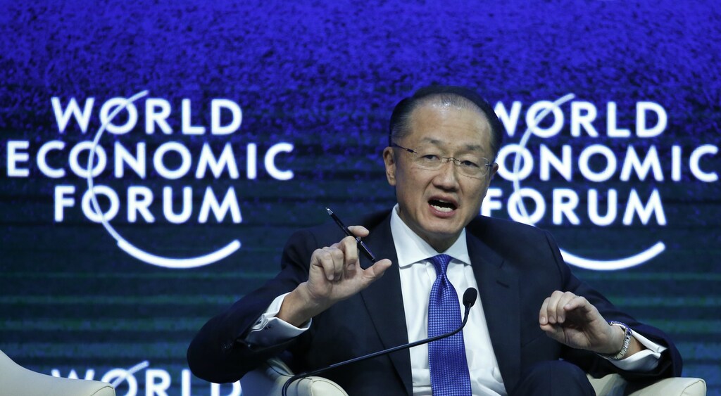 World Bank President Jim Yong Kim speaks during the session 'Tackling Climate, Development and Growth' in the Swiss mountain resort of Davos January 23, 2015. More than 1,500 business leaders and 40 heads of state or government attend the Jan. 21-24 meeting of the World Economic Forum (WEF) to network and discuss big themes, from the price of oil to the future of the Internet. This year they are meeting in the midst of upheaval, with security forces on heightened alert after attacks in Paris, the European Central Bank considering a radical government bond-buying programme and the safe-haven Swiss franc rocketing. REUTERS/Ruben Sprich (SWITZERLAND - Tags: BUSINESS POLITICS) - LR2EB1N0TCMRO