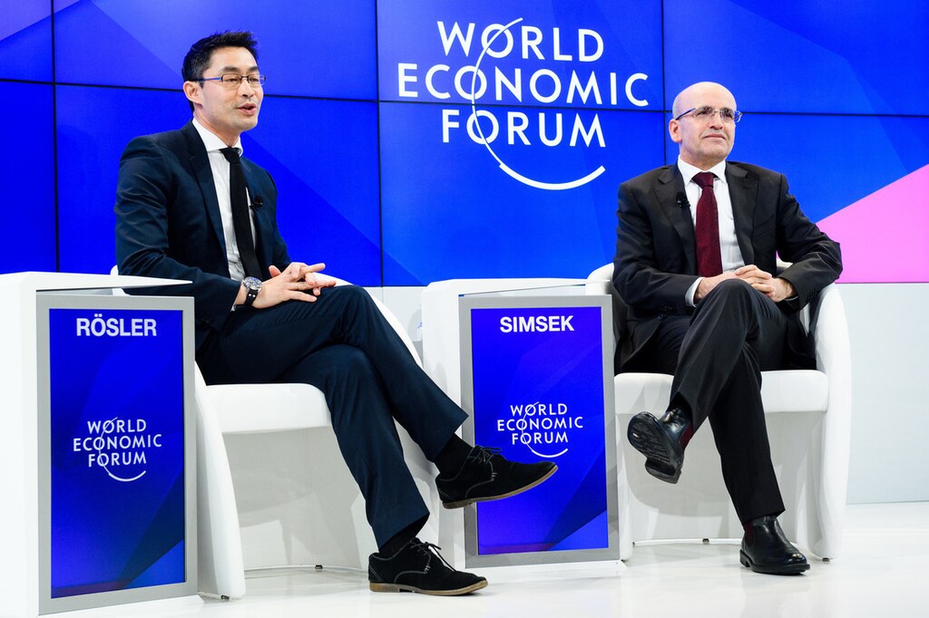 Mehmet Simsek, Deputy Prime Minister of Turkey and Philipp Rösler, Head, Regional and Government Engagement, Member of the Managing Board, World Economic Forum speaking during the Session "A Conversation with Mehmet Simsek, Deputy Prime Minister of Turkey" at the Annual Meeting 2017 of the World Economic Forum in Davos, January 20, 2017. .Copyright by World Economic Forum / Manuel Lopez