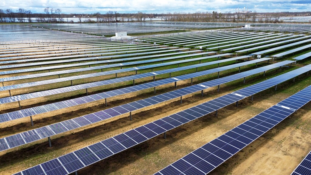 A drone view shows solar panels as they stand on Dave Duttlinger's farmland that he leased to Dunns Bridge Solar LLC in Wheatfield, Indiana, U.S., April 5, 2024. Demand for materials and critical minerals is set to shift as the global energy transition accelerates. This is the materials transition.