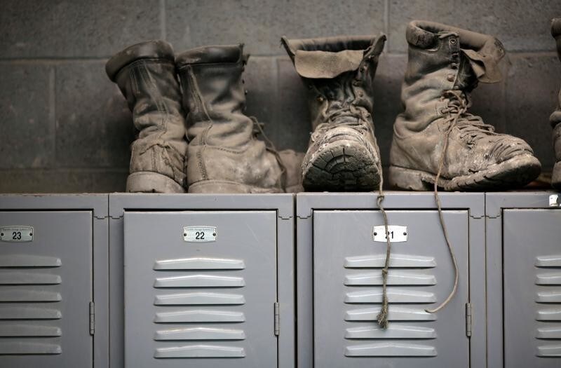 Coal mining boots are shown above miners' lockers before the start of an afternoon shift at a coal mine near Gilbert, West Virginia May 22, 2014. REUTERS/Robert Galbraith/File Photo GLOBAL BUSINESS WEEK AHEAD PACKAGE - SEARCH 'BUSINESS WEEK AHEAD 24 OCT' FOR ALL IMAGES - S1AEUITDYIAA