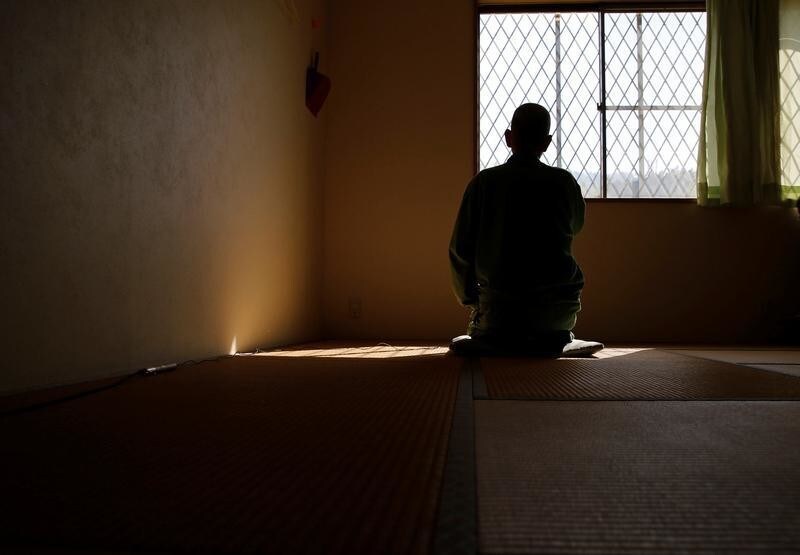 A male prisoner in his early 70s, serving a 13-year term for murder, kneels down during an interview with Reuters at the Tokushima prison in Tokushima, Japan, March 2, 2018. Picture taken March 2, 2018. REUTERS/Toru Hanai - RC18754797E0