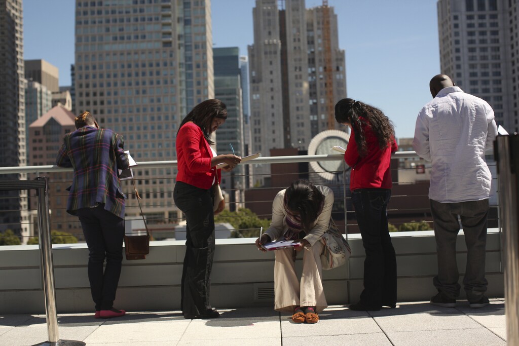 Job seekers apply for the 300 available positions at a new Target retail store in San Francisco, California August 9, 2012.