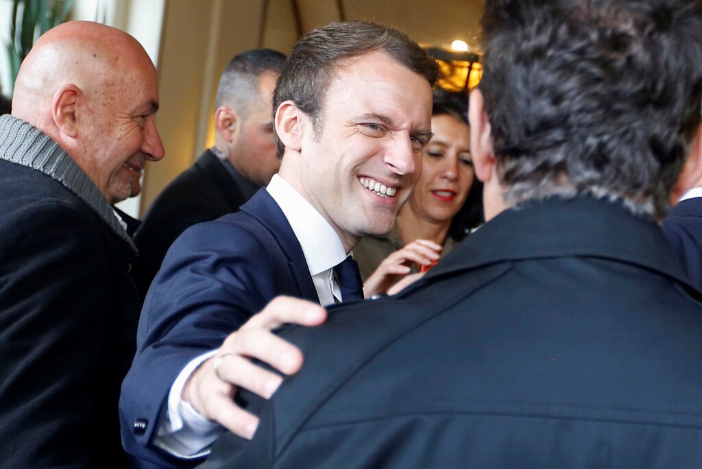 Emmanuel Macron, head of the political movement En Marche !, or Onwards !, and candidate for the 2017 presidential election, speaks with supporters during a campaign visit in Rodez, France, May 5, 2017. REUTERS/Regis Duvignau - RTS159S6