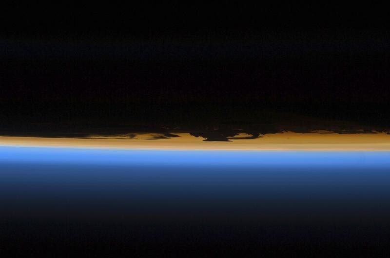 Layers of Earth's atmosphere, brightly colored as the sun sets, are featured in this image photographed by a STS-127 crew member on the Earth-orbiting Space Shuttle Endeavour in this NASA handout photo taken July 29, 2009. REUTERS/NASA/Handout (UNITED STATES SCI TECH) FOR EDITORIAL USE ONLY. NOT FOR SALE FOR MARKETING OR ADVERTISING CAMPAIGNS - GM1E57V0OFE01