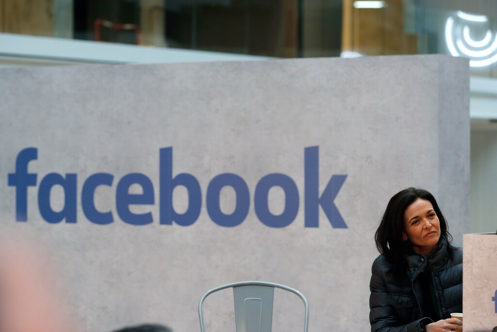 Sheryl Sandberg, Chief Operating Officer of Facebook, listens to speeches during a visit in Paris, France, January 17, 2017, at a start-up companies gathering at Paris' Station F site as the company tries to head off tougher regulation by Germany. REUTERS/Philippe Wojazer - RTSVUYJ