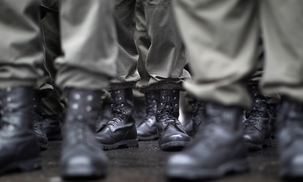 Boots of recruits of the Austrian armed forces (Bundesheer) are seen during the swear in ceremony on Austrian National Day (Nationalfeiertag) in Vienna October 26, 2011. REUTERS/Lisi Niesner (AUSTRIAPOLITICS - Tags: MILITARY) POLITICS) - RTR2T7Q1