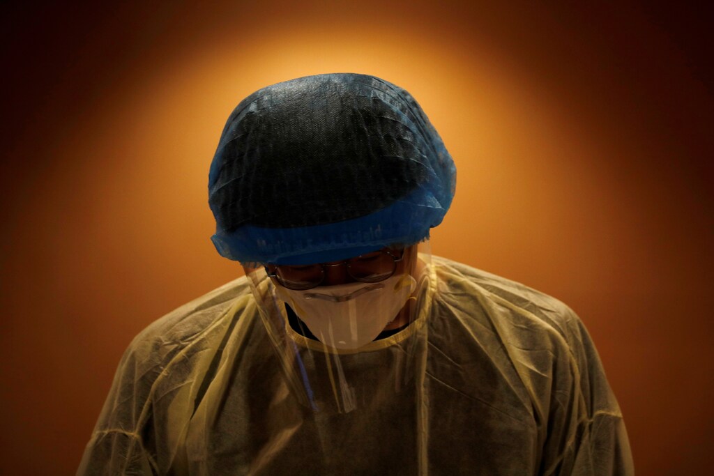 A healthcare worker is pictured at a swabbing station during the coronavirus disease (COVID-19) outbreak in Singapore January 25, 2021. REUTERS/Edgar Su TPX IMAGES OF THE DAY - RC21FL9HDCBY
