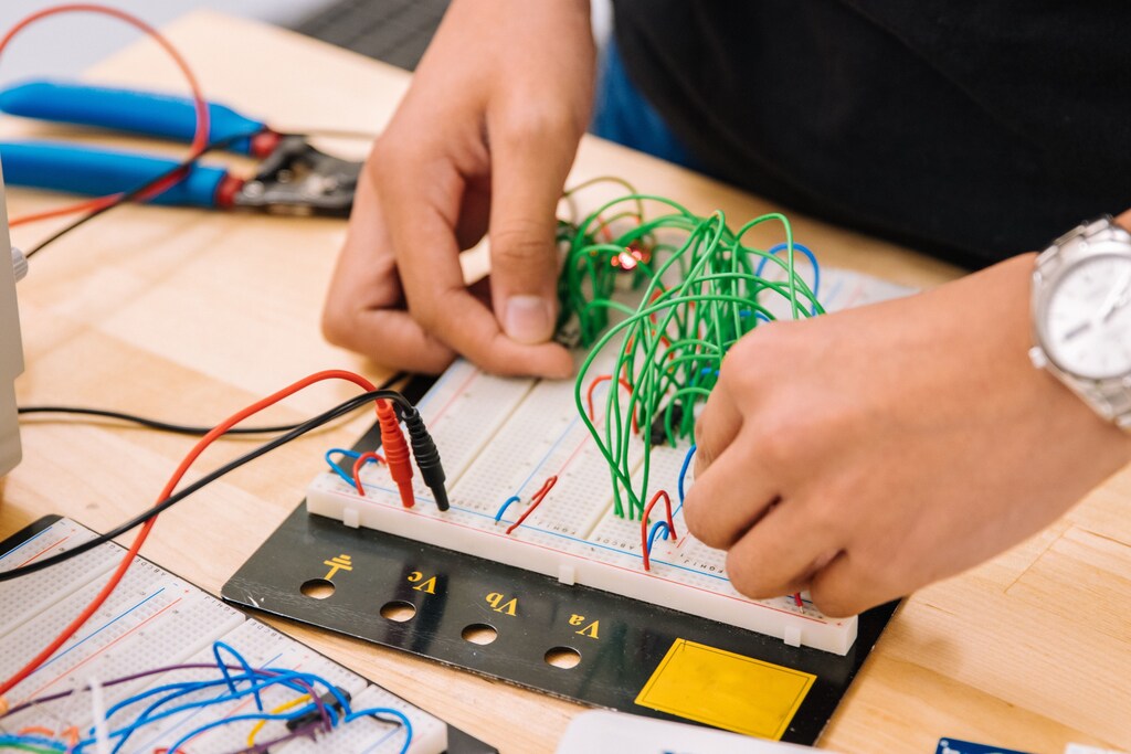 A pupil creating an electrical circuit, illustrating the power of Edtech
